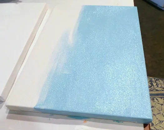 Canvas painted with light blue acrylic paint