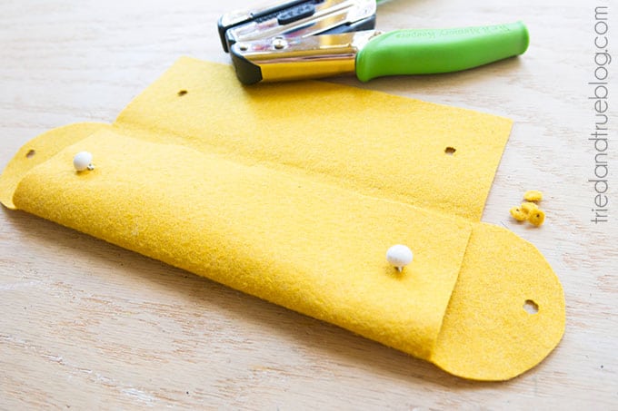 Holes punched in a felt pencil pouch