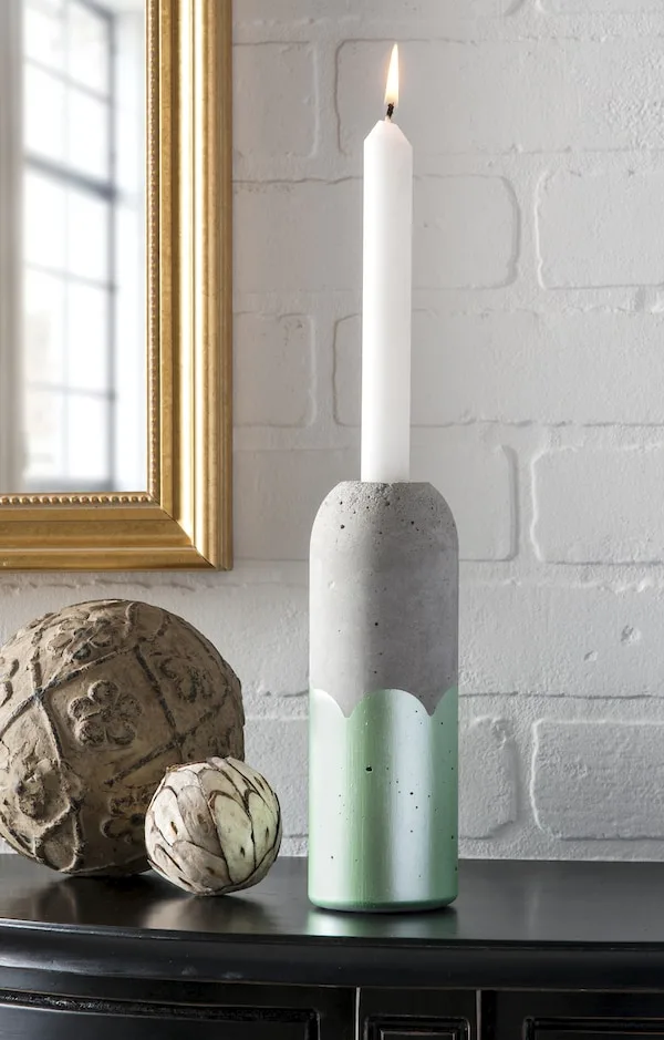 Make a concrete candlestick from a plastic bottle