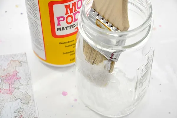 Painting the inside of a jar with Mod Podge