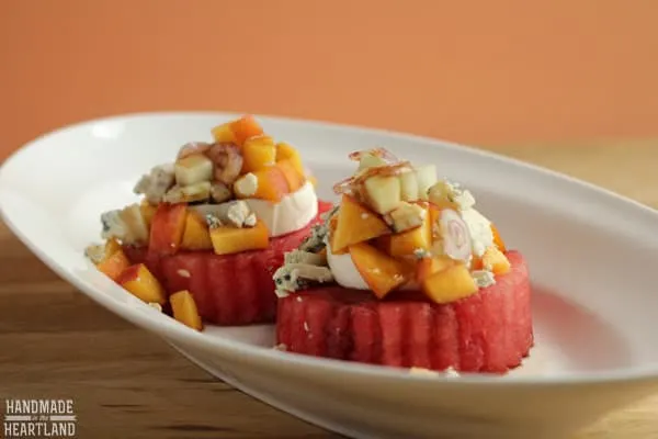 If you are in love with watermelon, this is an interesting salad you'll enjoy. It includes farm fresh peaches, fresh crunchy cucumbers, delicious watermelon all together paired with a slice of mozzarella, crumbled blue cheese, a few shavings of a shallot and drizzled with balsamic vinegar.