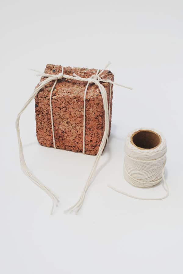 Tying brick with string