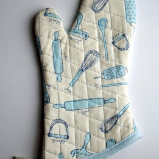 Quilted DIY pot holder sewn out of fun kitchen fabric!