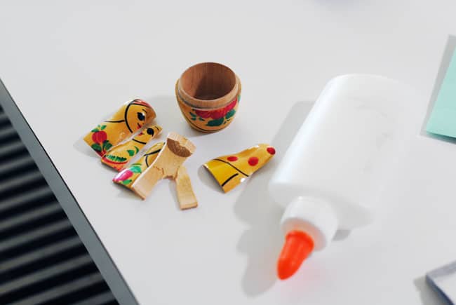 Repairing the nesting doll with glue