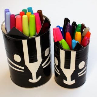 Learn how to make these black cat containers with duct tape - kids will love this Halloween craft!