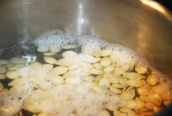 Pumpkin seeds boiling on the stove