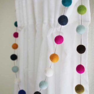 cropped-multi-colored-felt-garland-on-curtains.jpg