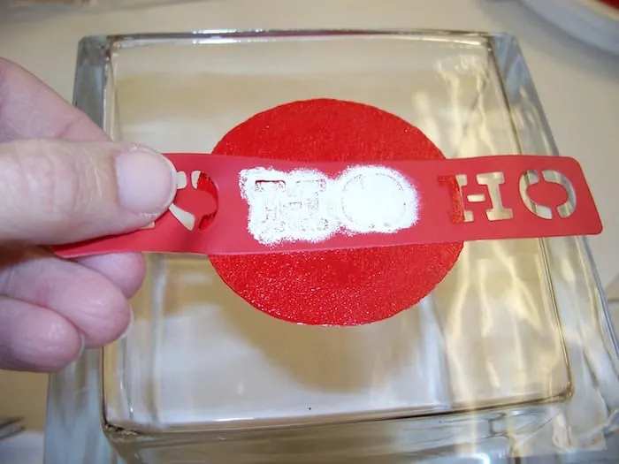 Painting "HO" in white over the center of the red circle