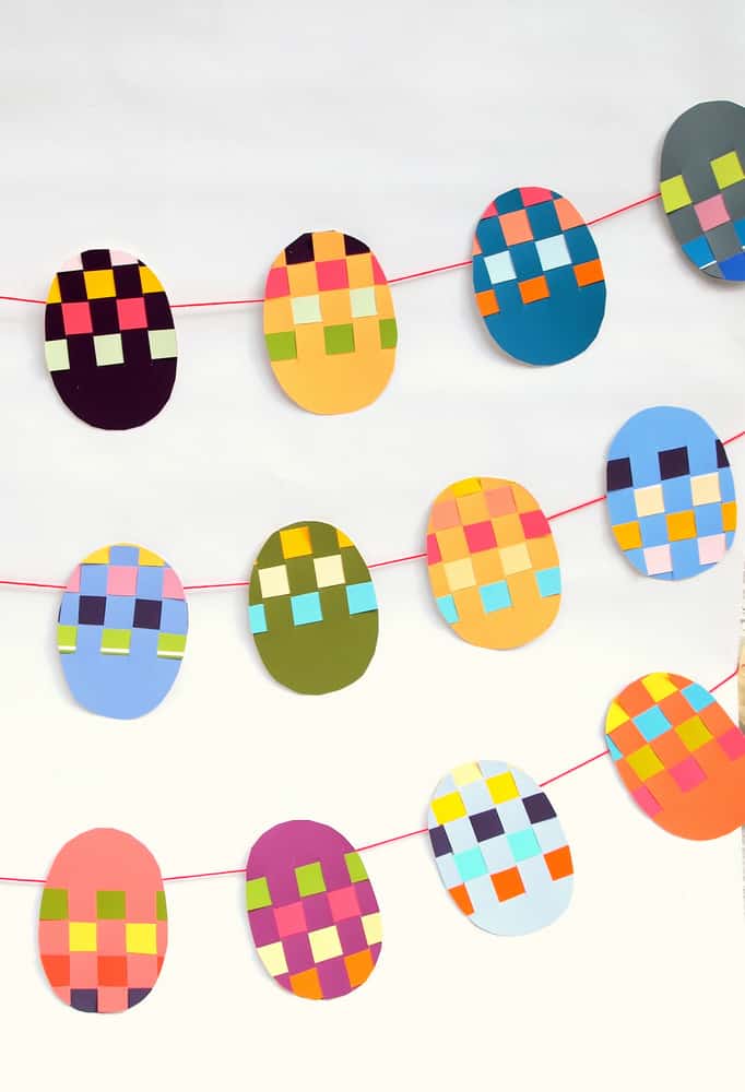 Paint chip eggs taped onto twine to create an Easter banner