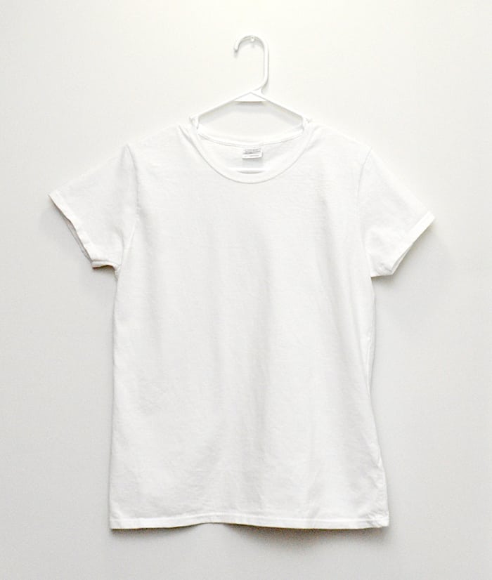 White t-shirt hanging from a white hanger