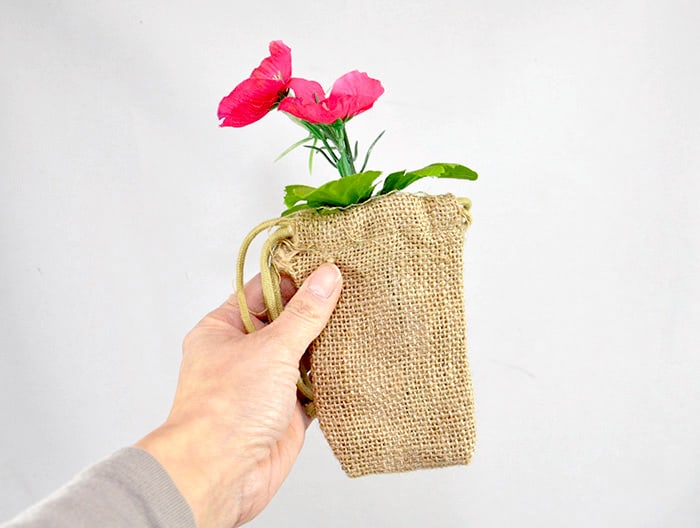 Faux flowers wrapped in burlap