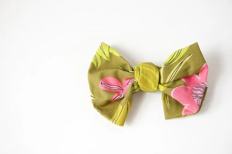 Raid your fabric stash, or the thrift store, and see how to make your own giant no-sew DIY bow to brighten up your day.
