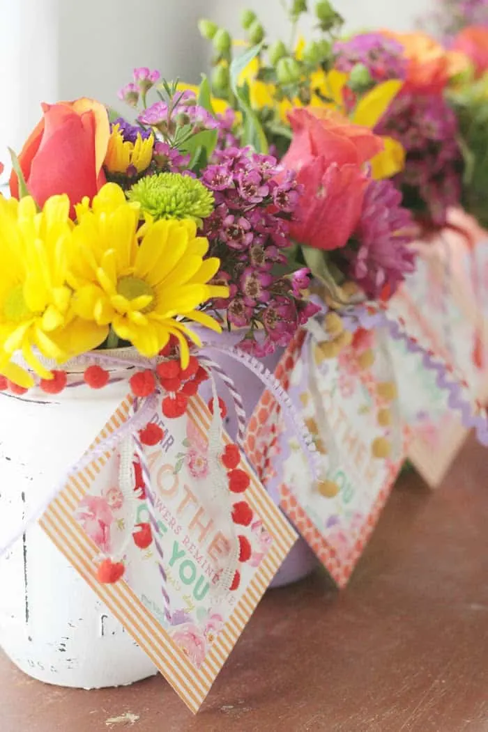 Mother's Day flowers in chalk painted mason jar vases with a free printable tied around the lip