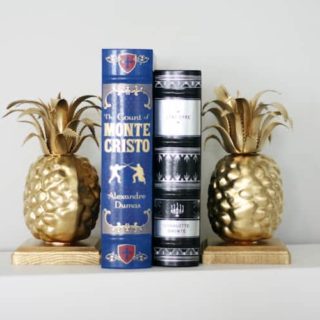 Learn how to make these simple, custom pineapple DIY bookends in just a few steps! The supplies are also very budget friendly.