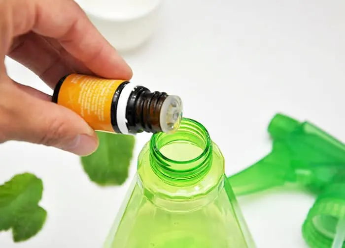Adding essential oils to a spray bottle