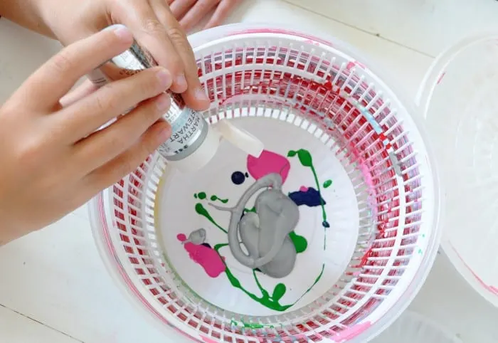 Spin art machine from a salad spinner - adding paint