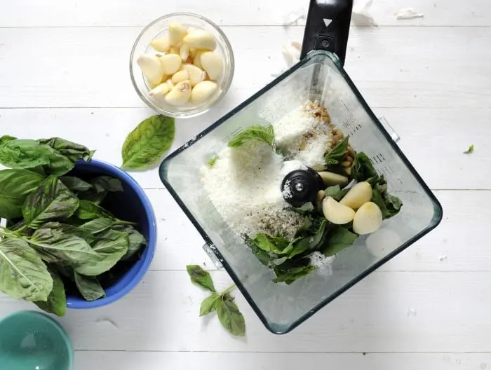 Homemade pesto recipe - ingredients combined in a blender