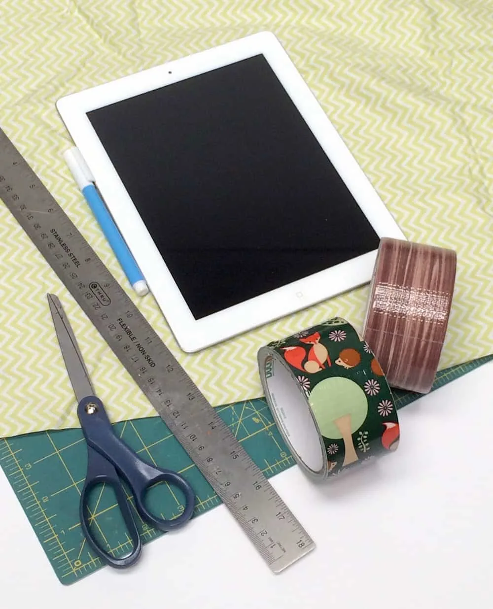 iPad, fabric, ruler, fabric marker, scissors, Duck Tape