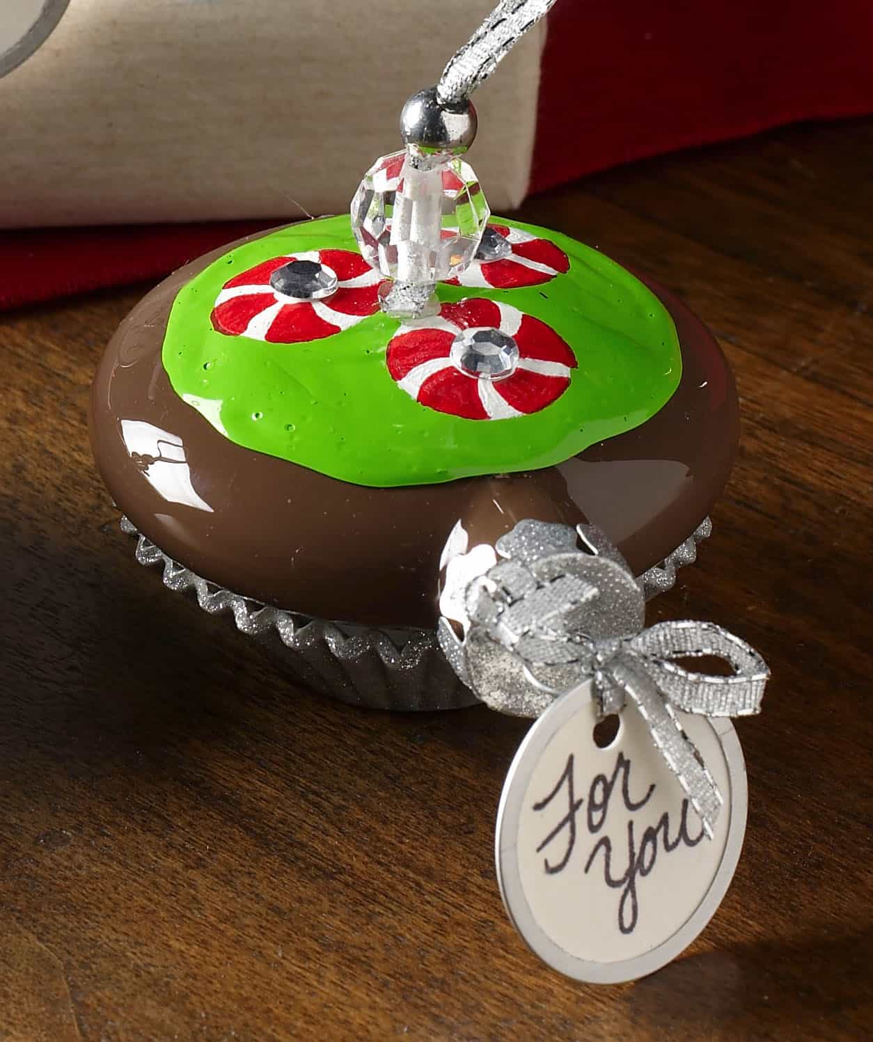These handmade Christmas ornaments are regular ornaments painted to look just like cupcakes! Have you ever seen anything so sweet?
