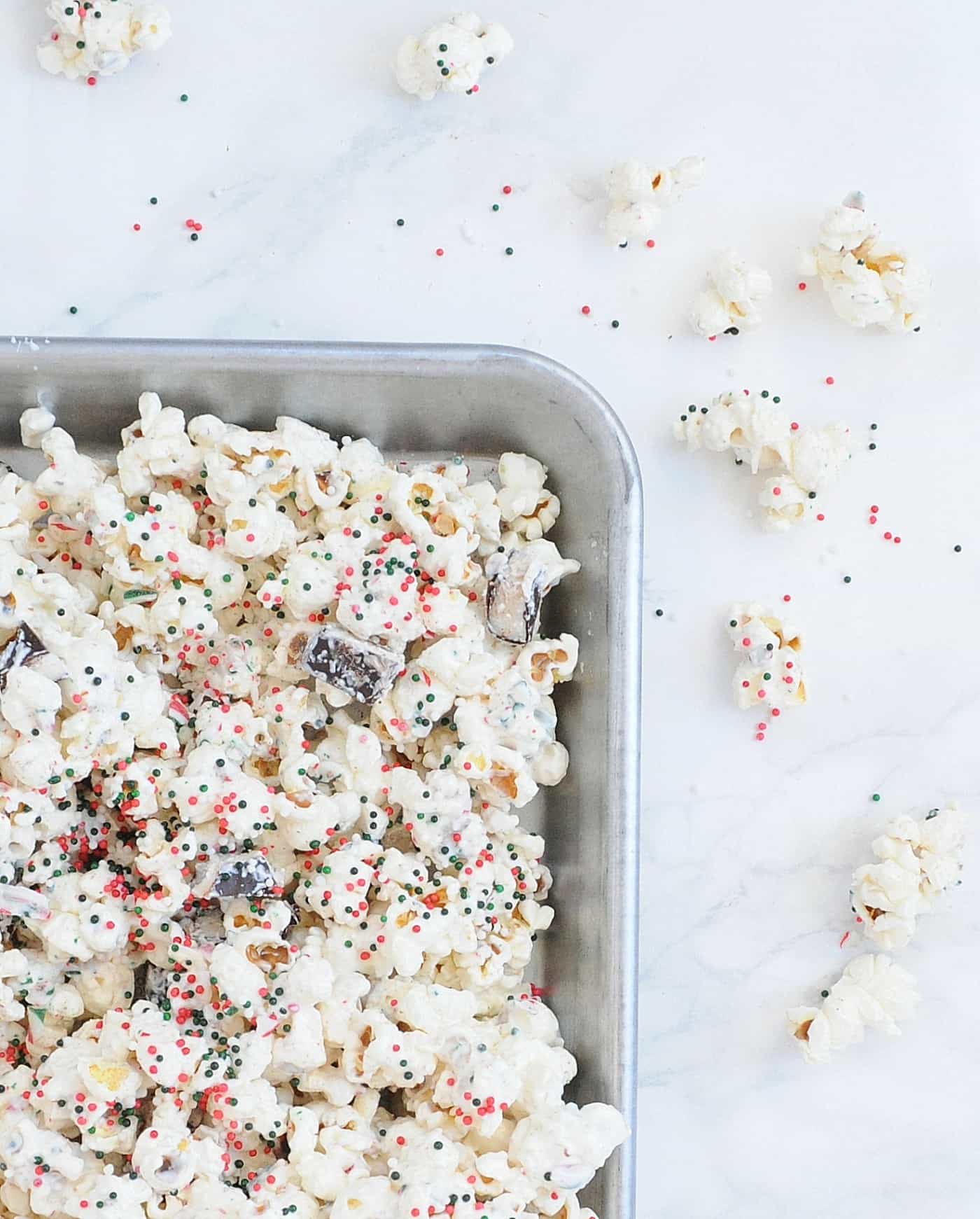 holiday popcorn in a metal pan on a countertop
