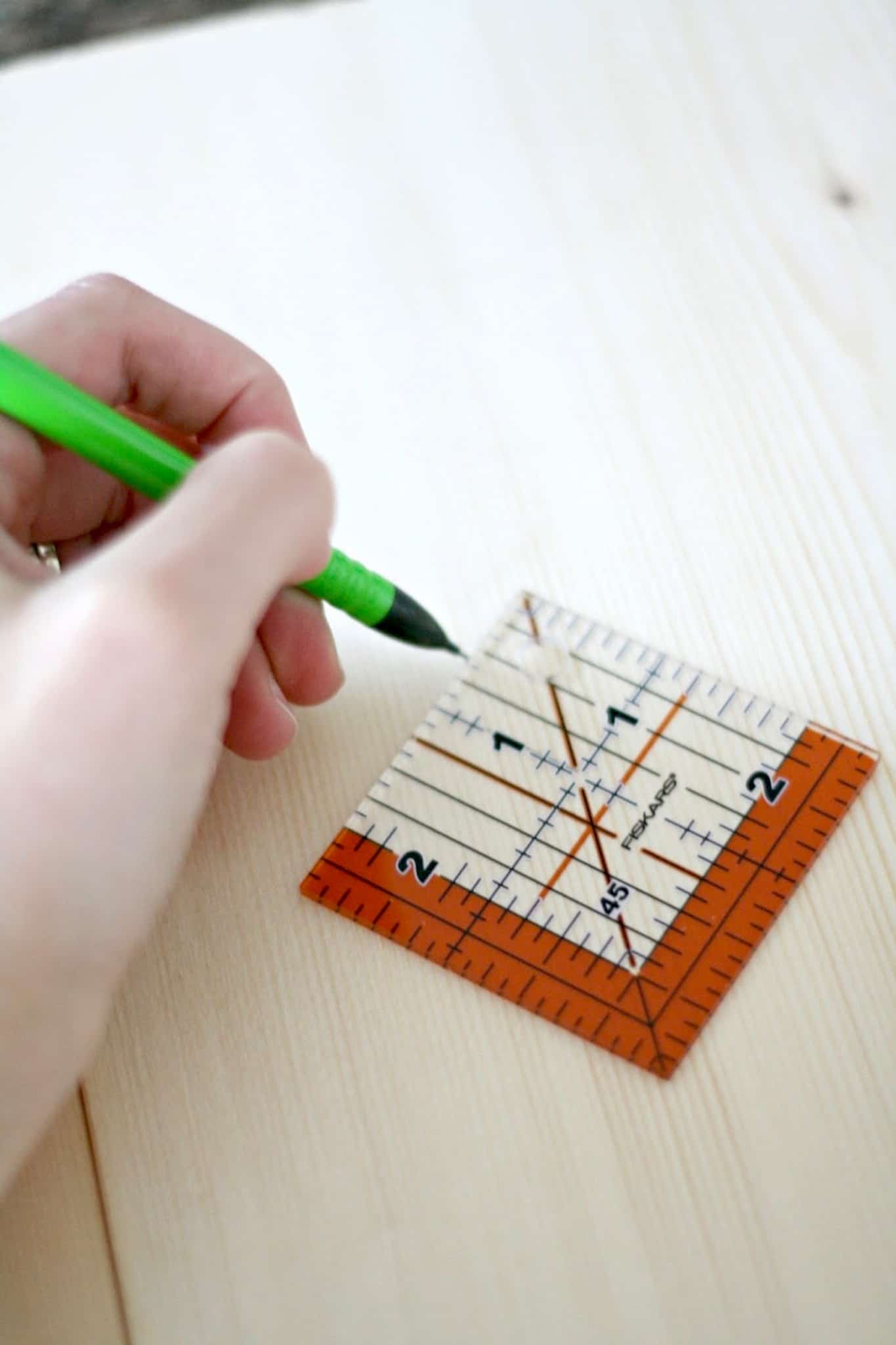 Drawing a square using a pencil and a Fiskars plastic square