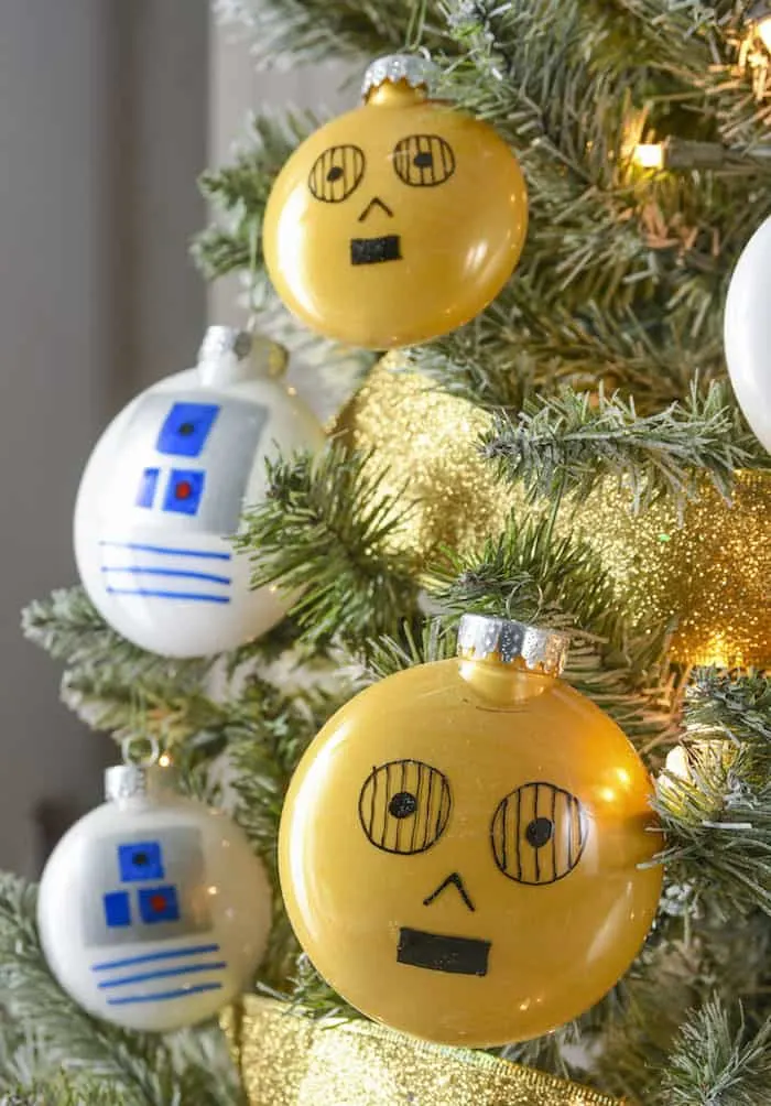 Rebels will love this droid themed Star Wars Christmas tree! Learn how to easily make your own C-3PO and R2-D2 ornaments.