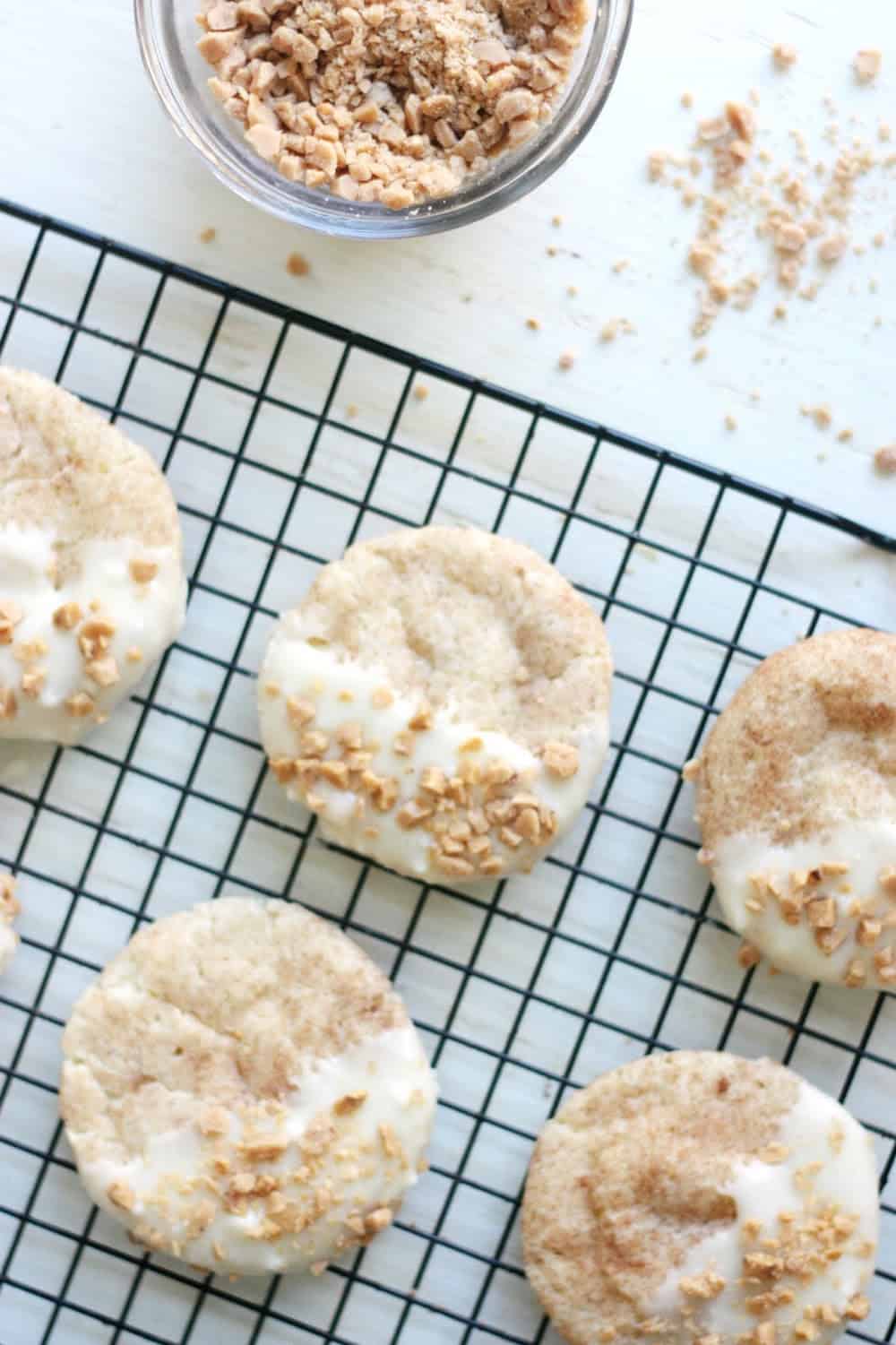 Toffee sprinkled onto white chocolate snickerdoodles