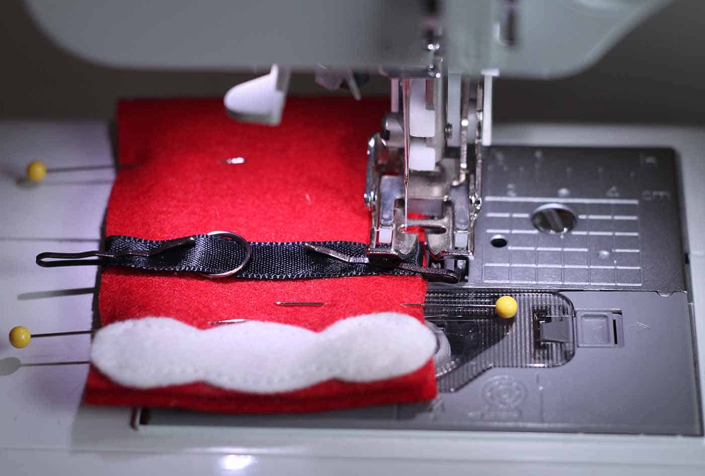 Sewing around the edges of the Santa gift card holder