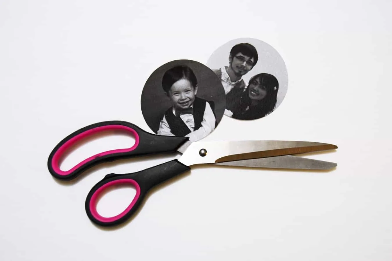 black and white circle photos cut out with a pair of scissors