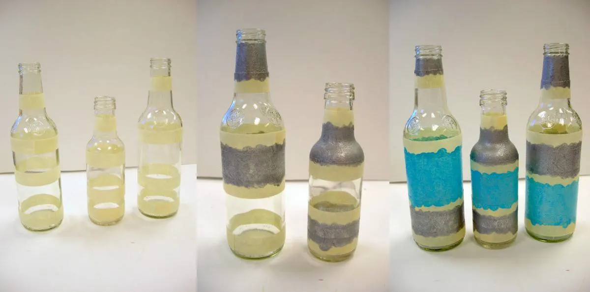 Clear bottles covered with stencil tape and painted with enamel paint