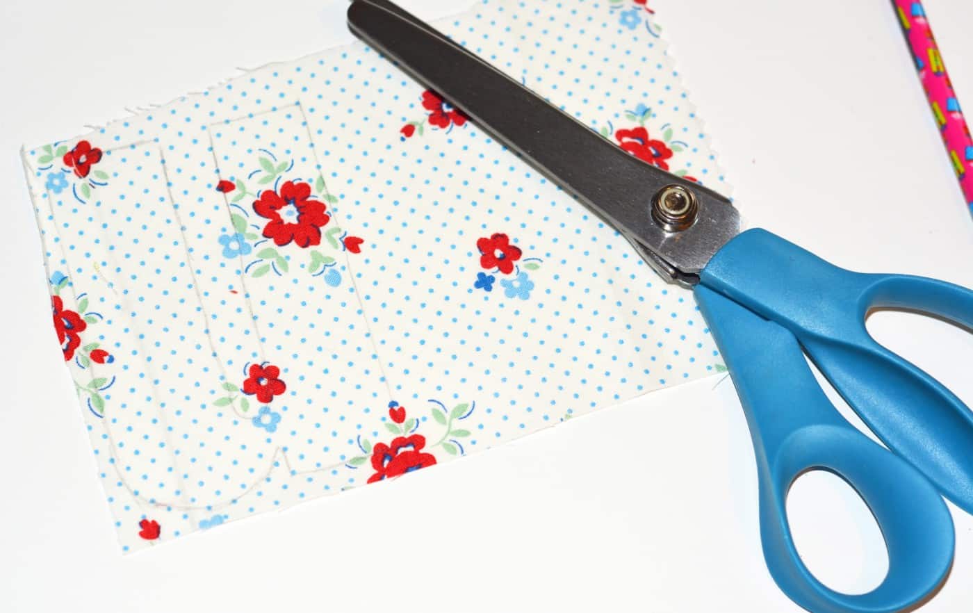 Pair of pinking shears with a piece of fabric