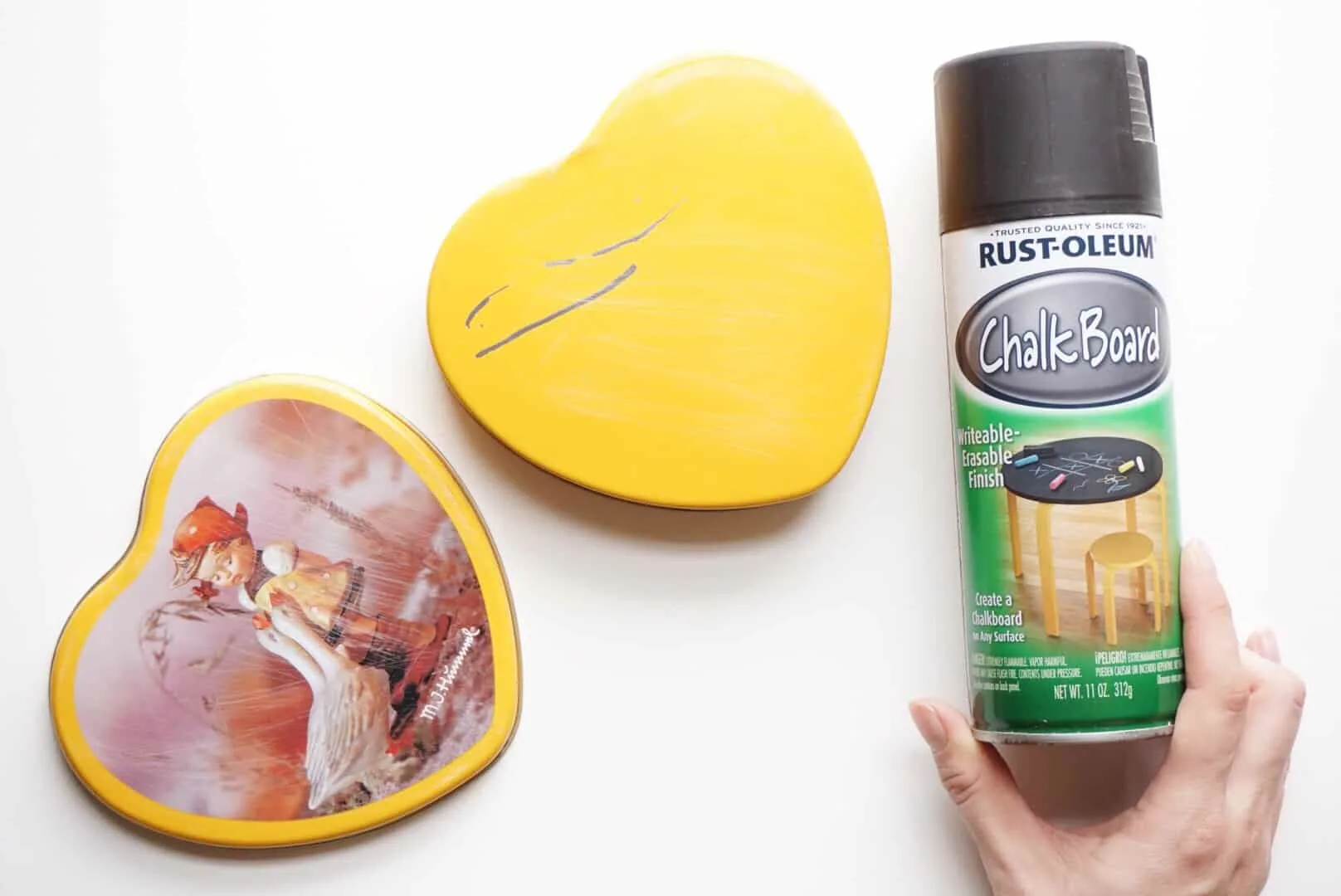 Sanded heart tin with a can of chalkboard spray paint