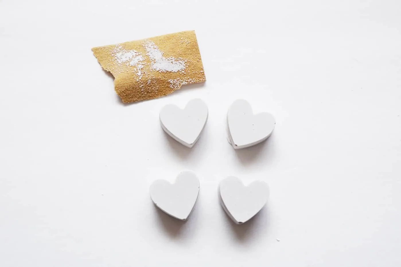 Hearts sanded down with smooth grit sandpaper