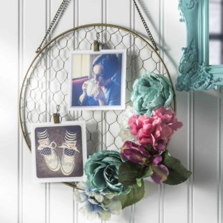 Hanging photo frame decorated with faux flowers