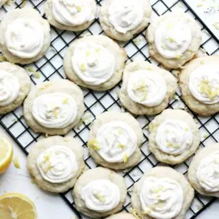 Lemon cookies with cream cheese icing on a wire rack