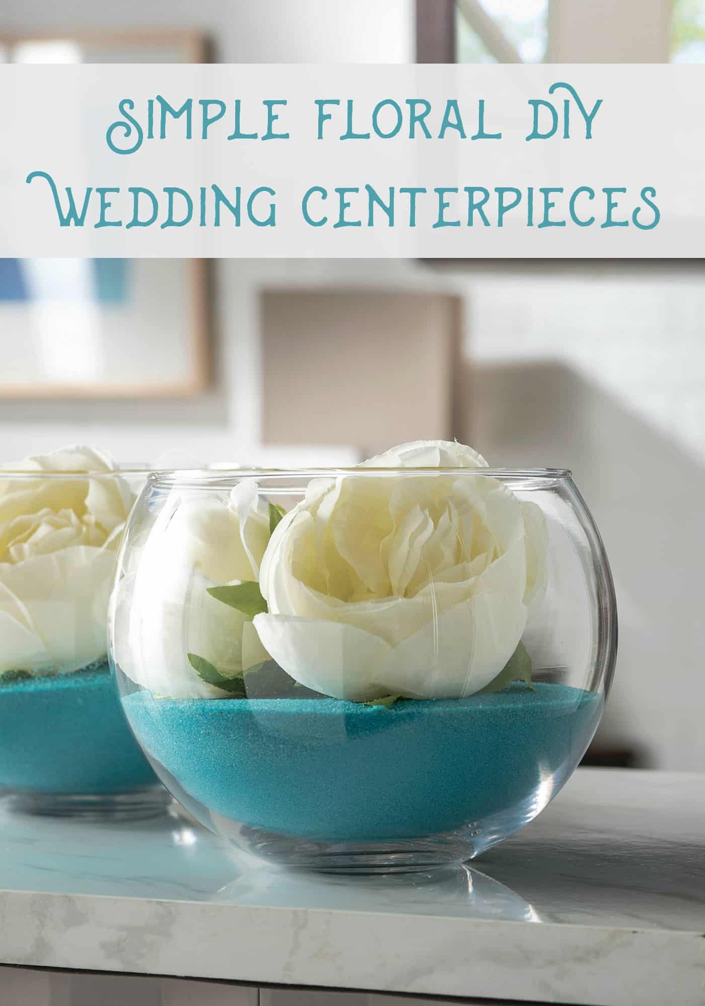 DIY wedding centerpieces using sand and faux flowers