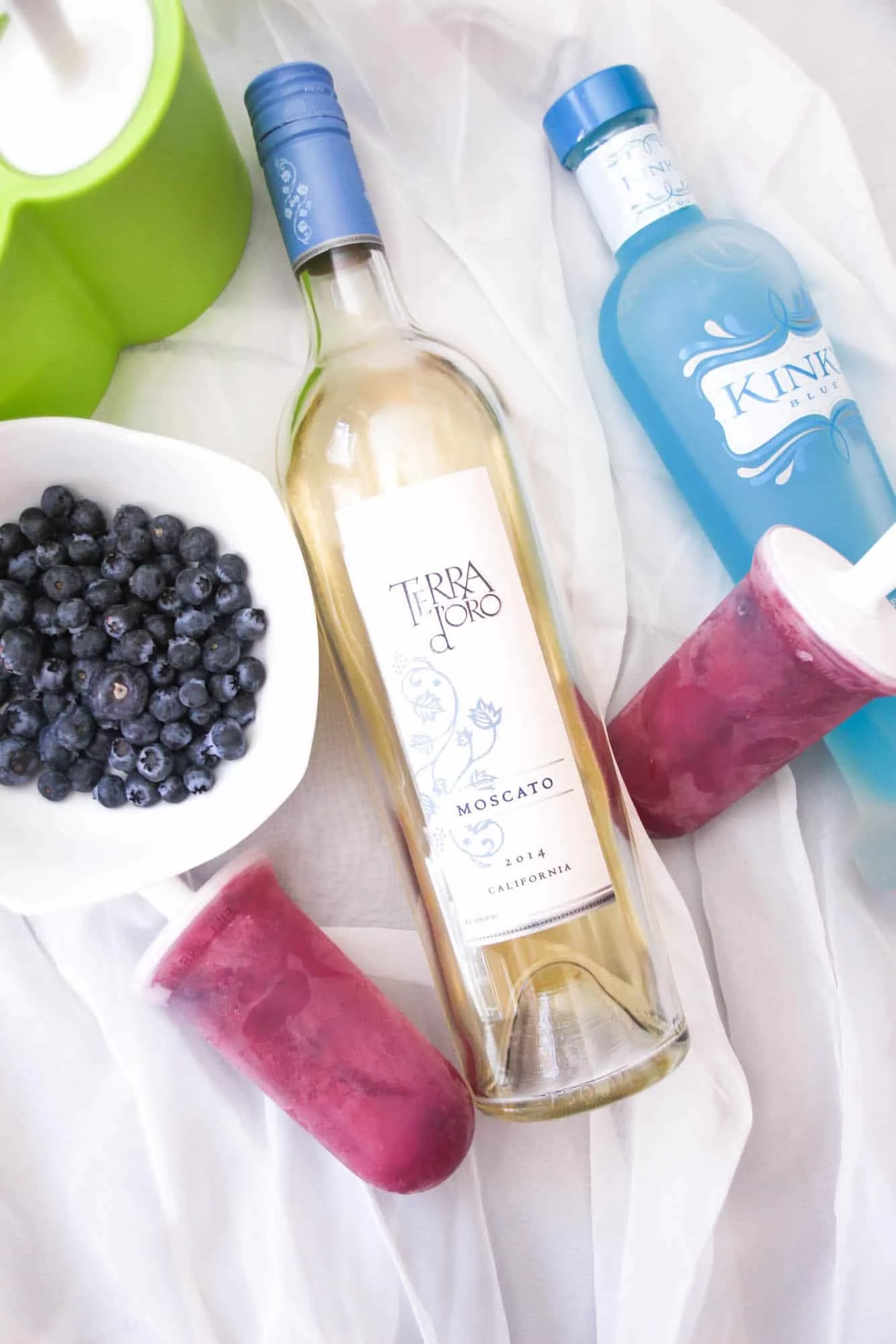 Terra d'oro moscato wine, blueberries, Kinky Blue, and boozy popsicles
