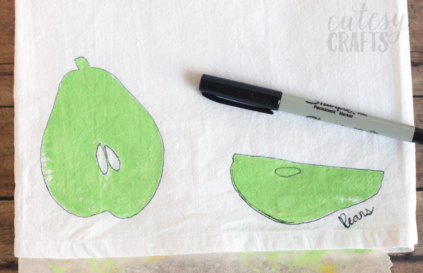 Outline a fruit stamp with a permanent marker