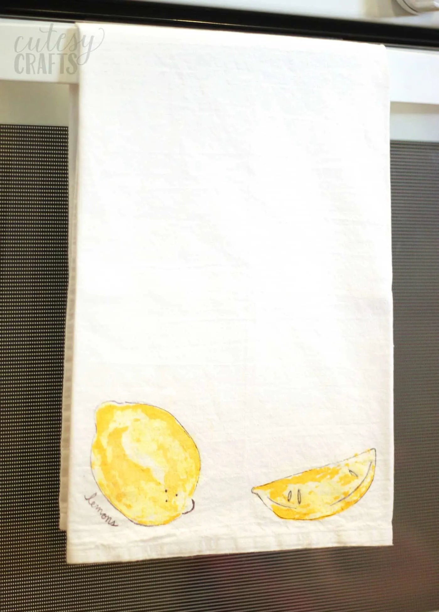 Fruit stamping on a tea towel with lemons