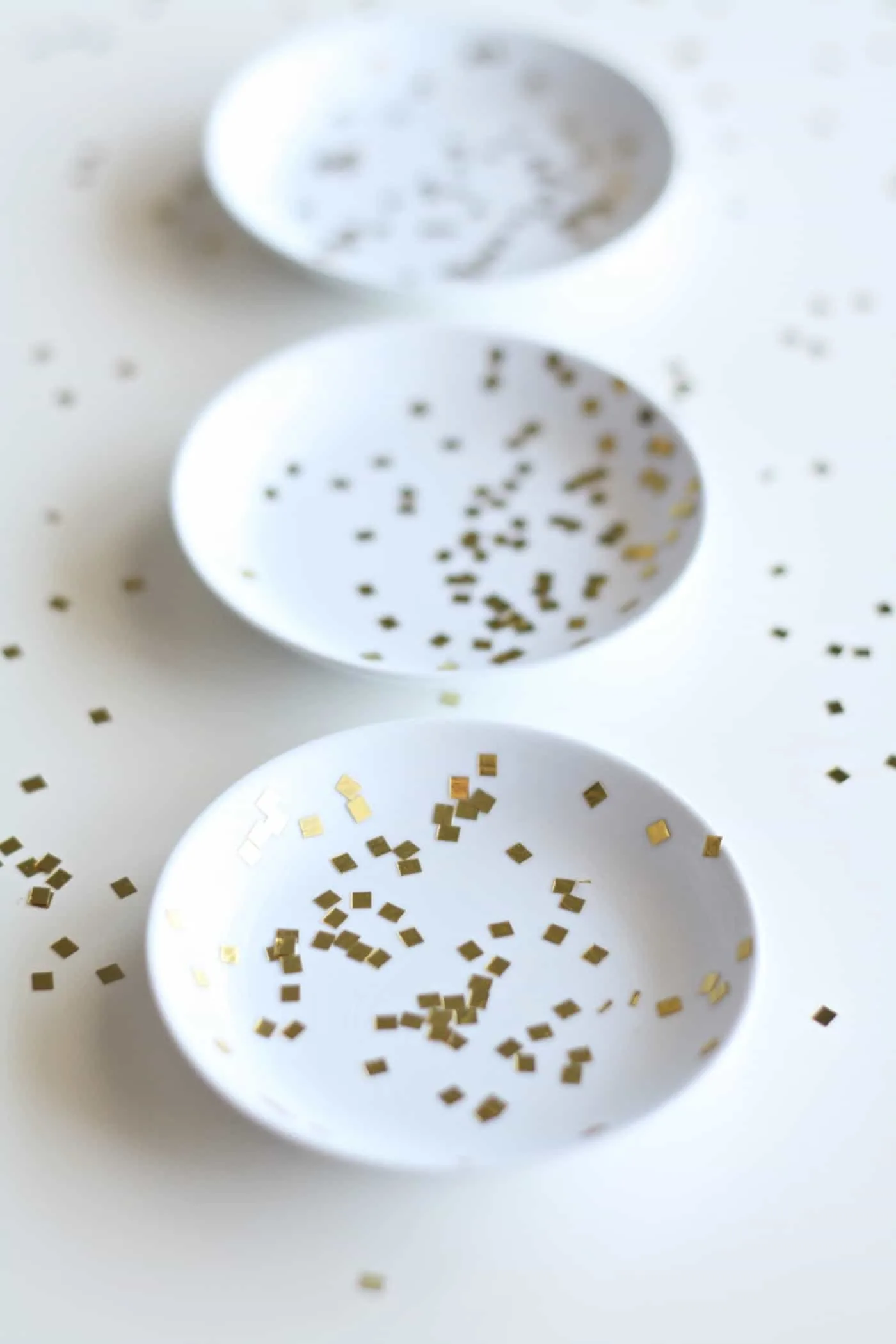 Three ring dishes decorated with glitter confetti