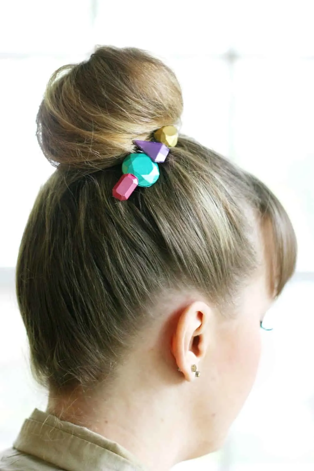 DIY metallic hair accessories in a woman's hair