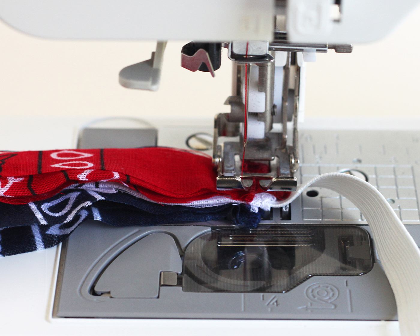 Sewing elastic into bandanas with a sewing machine