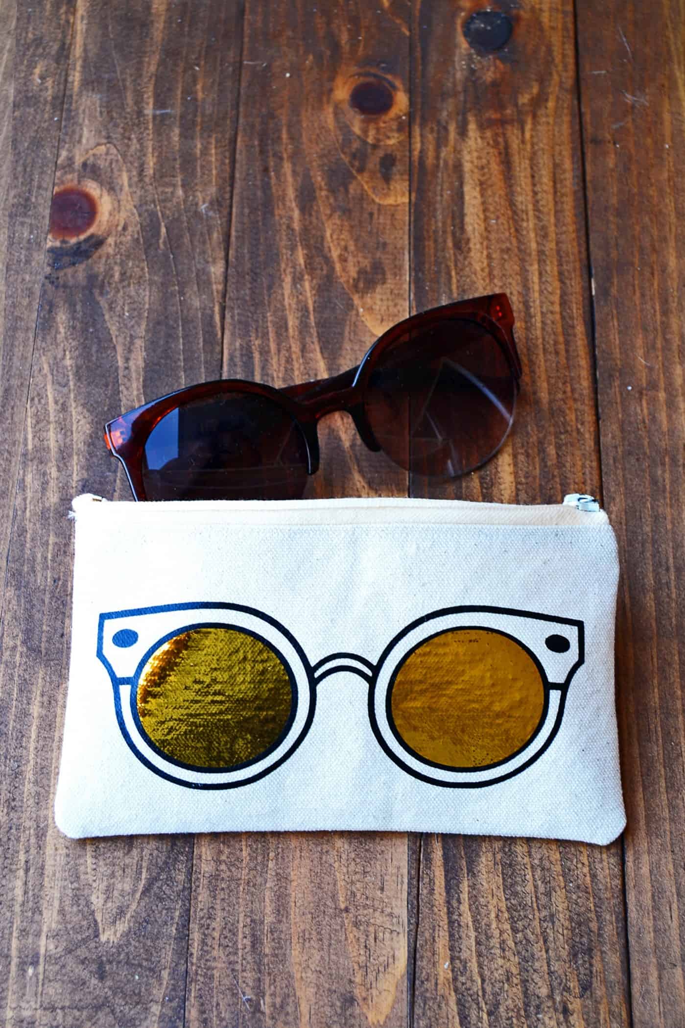 Learn how to make a unique DIY sunglasses case using heat transfer vinyl and a die cutter. This trendy project includes a free template!