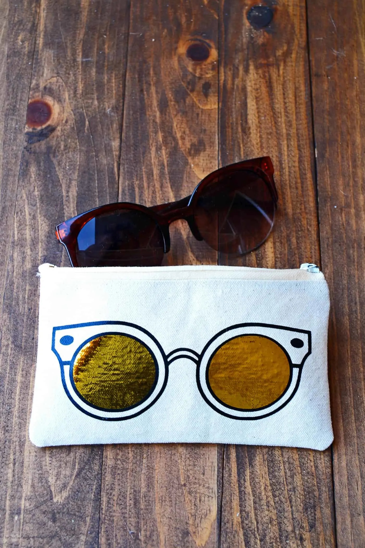 Learn how to make a unique DIY sunglasses case using heat transfer vinyl and a die cutter. This trendy project includes a free template!