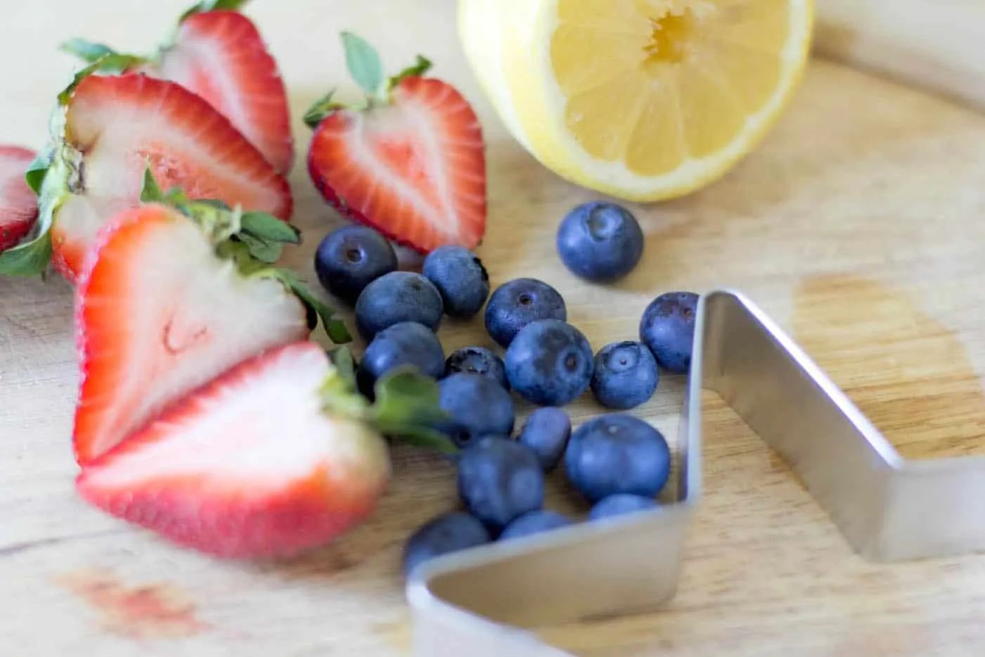 Strawberries, blueberries, lemon and a star cookie cutter