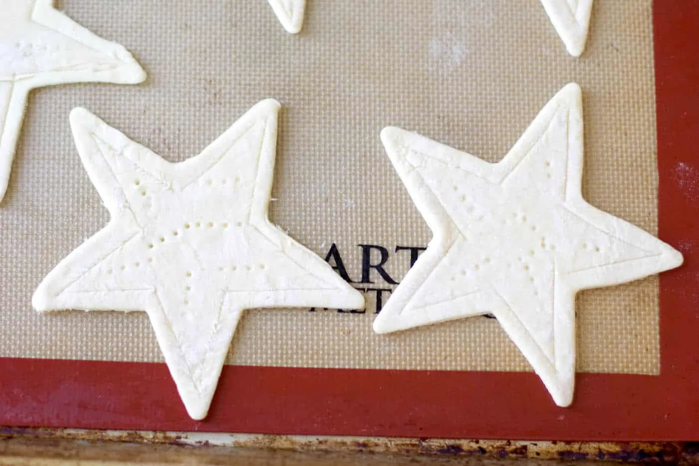 cut out stars and place them on a baking sheet