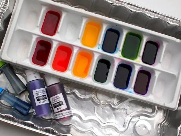 Food coloring with water in an ice cube tray