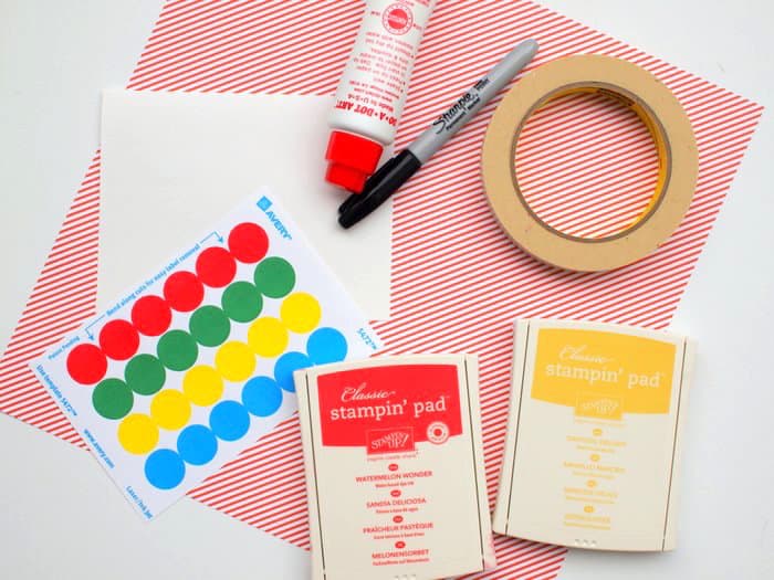White card, colored dot stickers, stamp pads, Sharpie, striped paper, masking tape