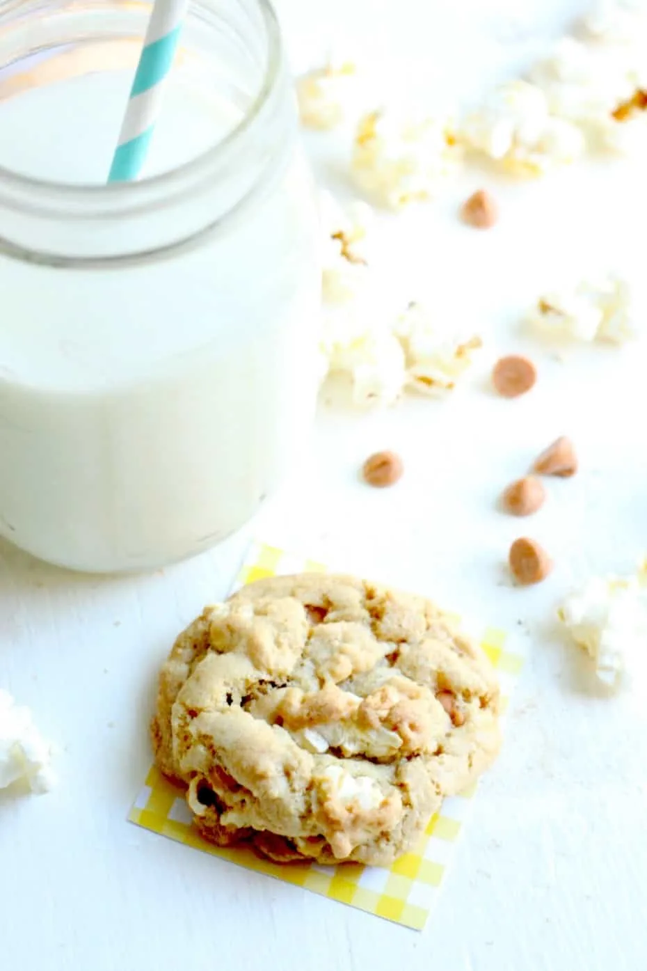 Delicious popcorn cookies with butterscotch chips and a glass of milk
