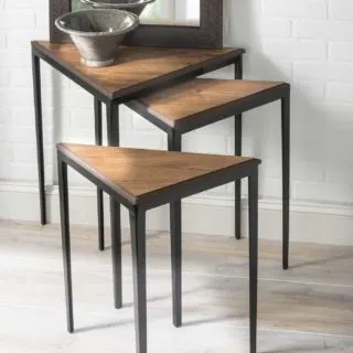 Learn how to revamp nesting tables using vinyl flooring! Leftover flooring makes a perfectly resilient and cost effective tabletop. We love the results!